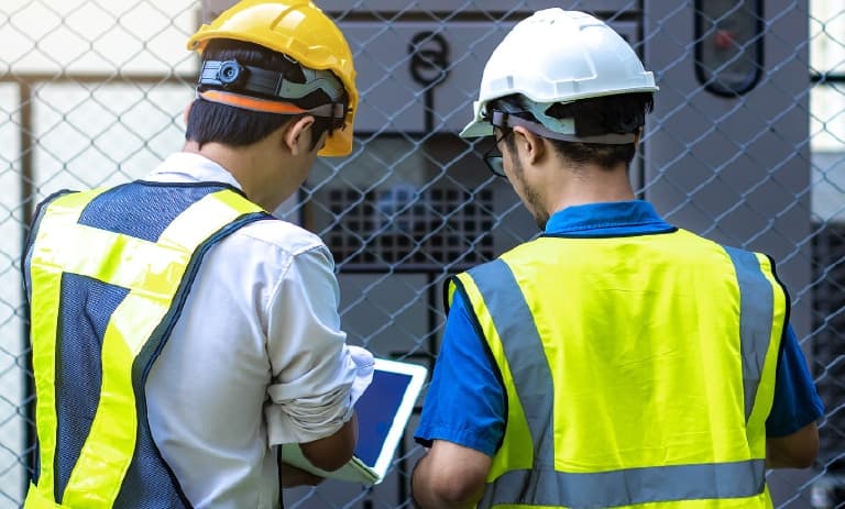 Two field workers inspection power grid utilities