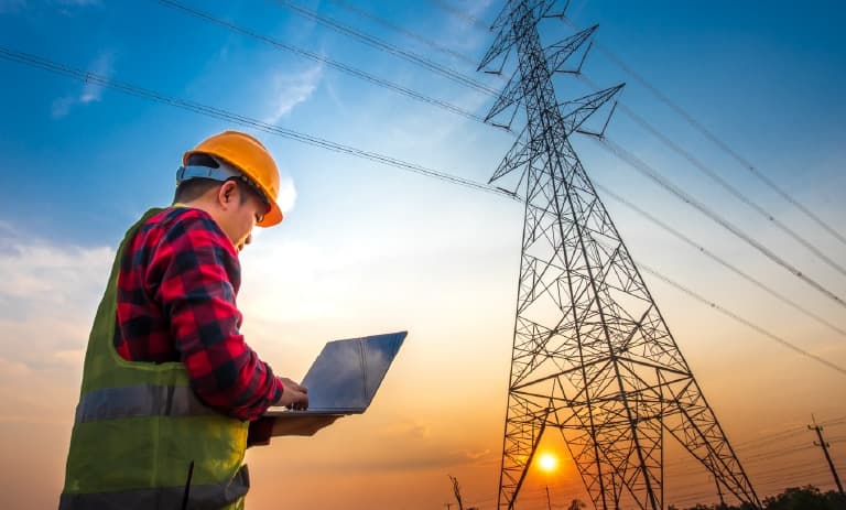 Field worker monitoring power grid asset