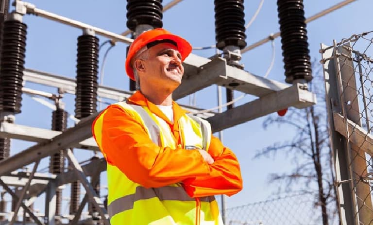 Field worker near bushings