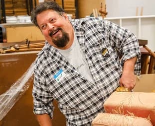 Qualitrol volunteer working on a community carpentry project
