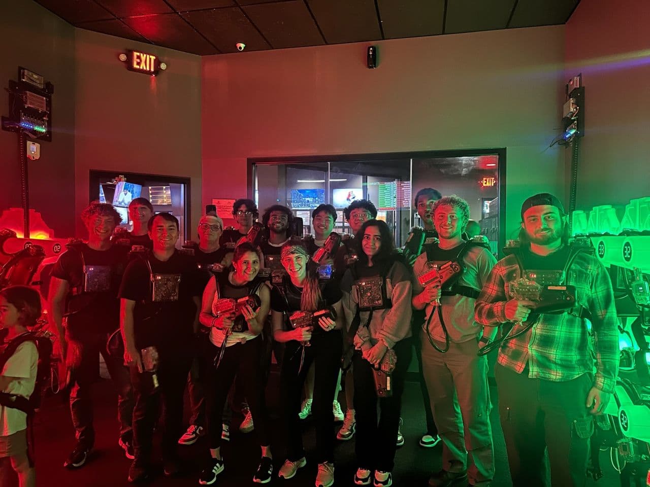 Group of Qualitrol Co-Op program participants playing laser tag team building activity