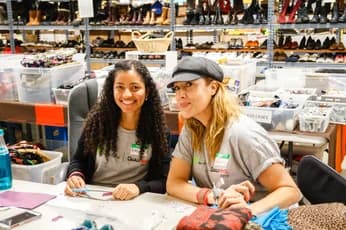 Two Qualitrol volunteers working on an arts and crafts project